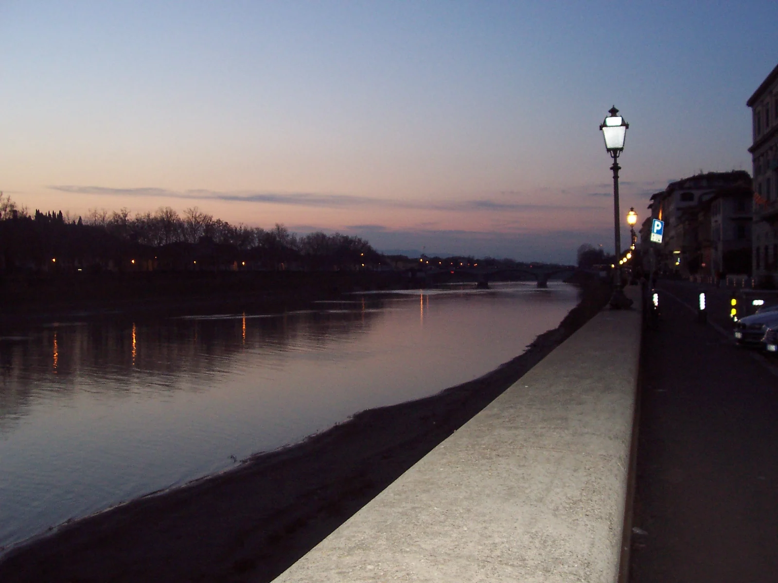 The Arno riverfront at dusk in Florence