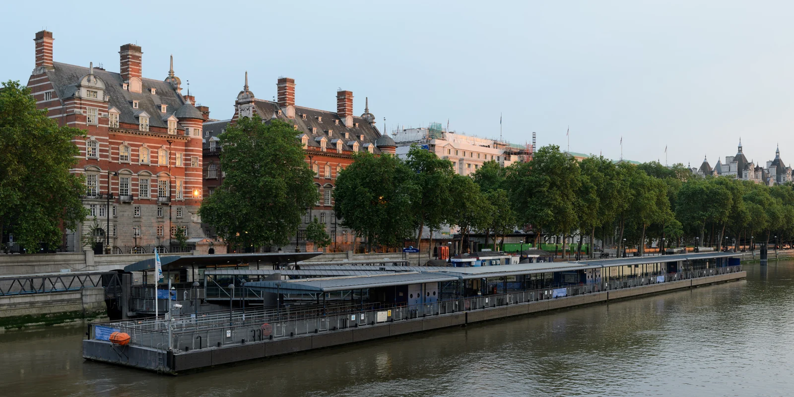 Westminster riverside and moored boats seen from Westminster Bridge